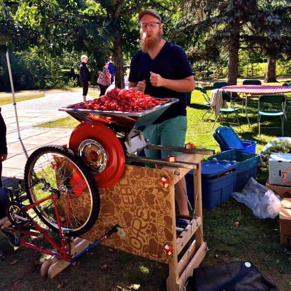 Operation Fruit Rescue Edmonton bicycle powered apple crusher with a load of apples